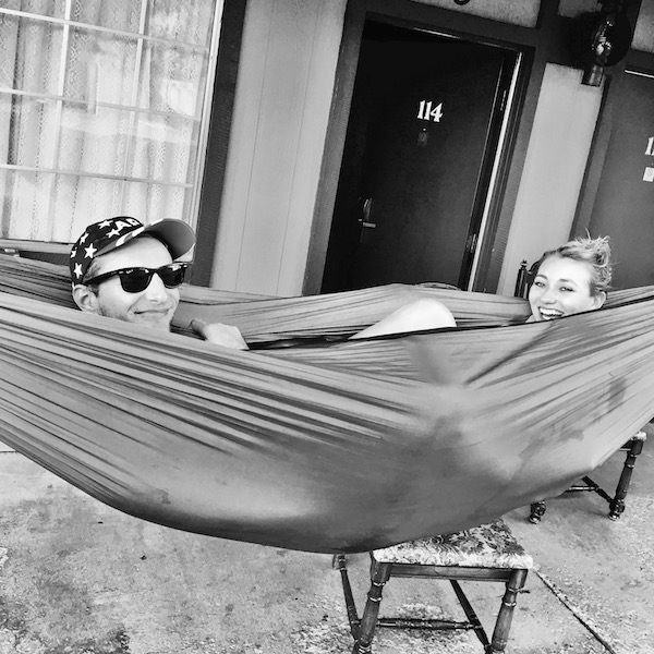 Couple sitting together in a hammock